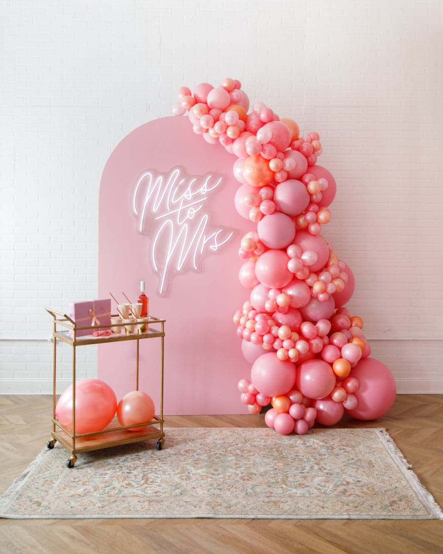 Rosé Bubbles – The Aadi Panel with Garland and Neon Sign | Purchase